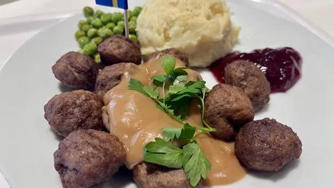 IKEA Swedish meatballs served with mashed potatoes, green peas, cream sauce.. 写真素材