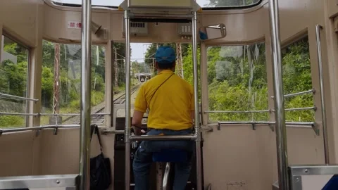 Ikoma Cable Car Operator Driving Mountain Funicular Through Scenic Green Forest Stock Footage 341337988