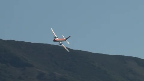 IL-114 - Russian twin-engine turboprop aircraft.  performs aerobatics. Stock Footage 125610579