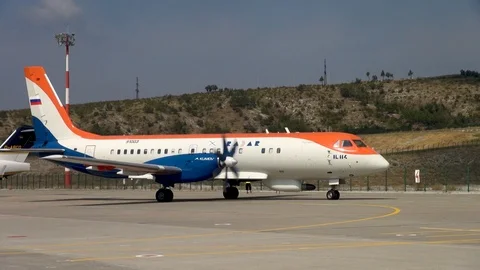 IL-114 twin-engine turboprop aircraft company Radar moves towards parking. Stock Footage 125610526