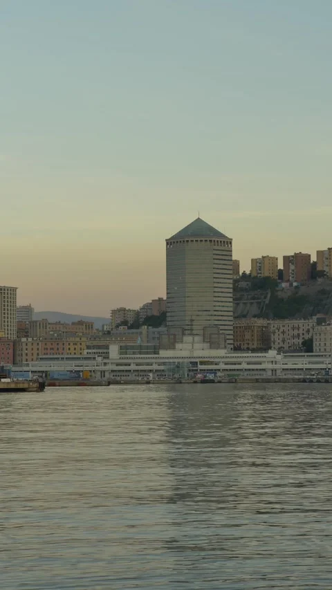 Il Matitone skyscraper reflection in Genoa harbor, vertical, Italy Видео 335634730