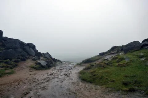 Ilkley Moors Muddy path into the mist Stock Photos