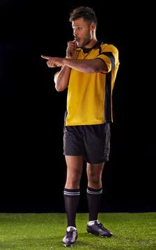 Ill be harsh but fair. Shot of a referee against a black background. Stock Photos