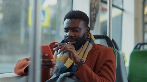 Ill bearded african man reading successful business news on smartphone Stock Footage 121474732