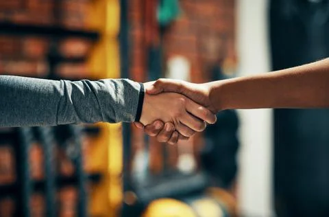 Ill help you get in better shape. two unrecognizable people shaking hands in a Stock Photos