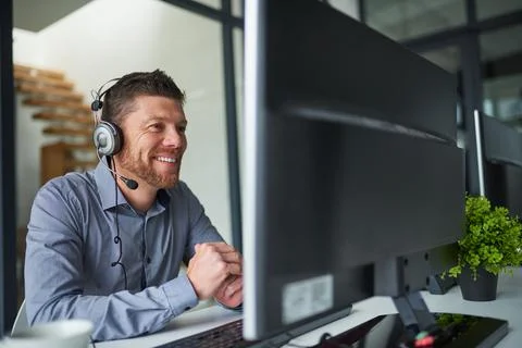 Ill help you sort the problem out. Shot of a mature man working on a computer Stock Photos
