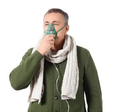 Ill mature man using nebulizer on white background Stock Photos