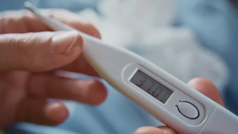 Ill Patient Checking Body Temperature with Digital Device Видео 332889091
