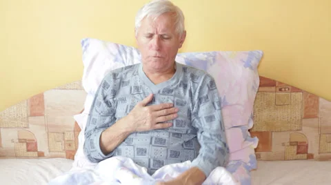 Ill senior man coughing Stock Footage 33740974