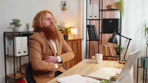 Ill sick man feeling overeating pain touching stomach during work process on Vidéo 278006692