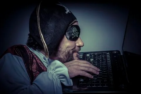 Illegal, computer security, hacker pirate dress with hat and skull Stock Photos
