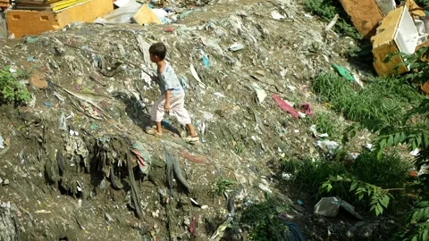 Illegal dumping garbage slum polluted piled layered waste populated Stock Footage 342395925