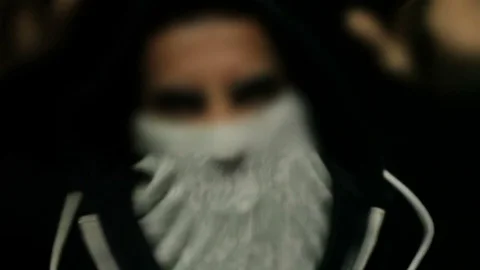 Illegal Match, Man with Covered Face Angry at Camera Stockbeeldmateriaal 73318501