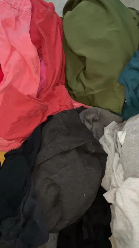 Illegal pile of post-consumer clothes not recycled according to Commission Stock Footage 257030630