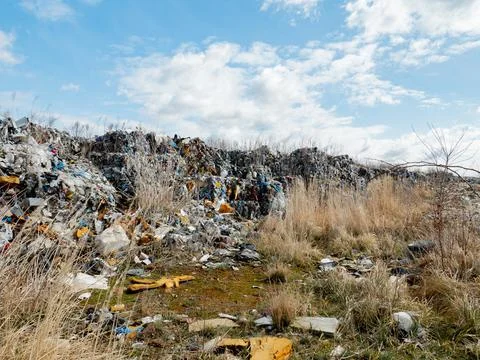 Illegal plastic dump. The toxic plastic exported from Germany is collected in Stock Photos