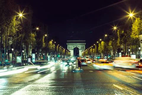 Illuminated Arc de Triomphe and the avenue Champs-Elysees in Paris. Famous 스톡 사진