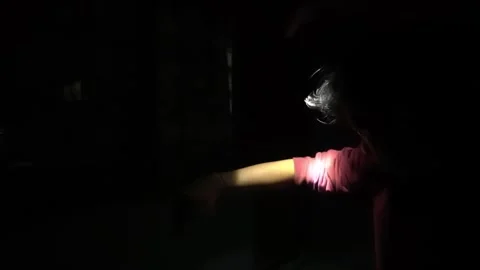 Illuminated Arm in Darkness with Flashlight Stock Footage 313468019