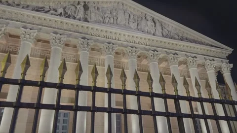 Illuminated Assemblée Nationale Facade Behind Golden Tipped Fence Paris, France Stock Footage 323802762