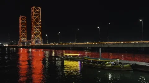 Illuminated Bridge at Night with Reflections Stock Footage 292163023