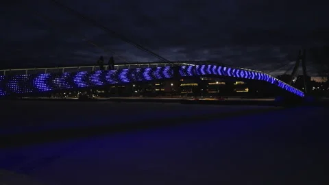Illuminated bridge over the river in the night, gimbal walk shot. Stock Footage 236016040