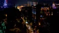 Illuminated buildings and busy streets with cars in Batumi at night, urban life HD Footage