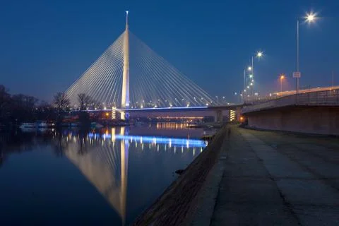 Illuminated cable-stayed bridge at night Stock Photos