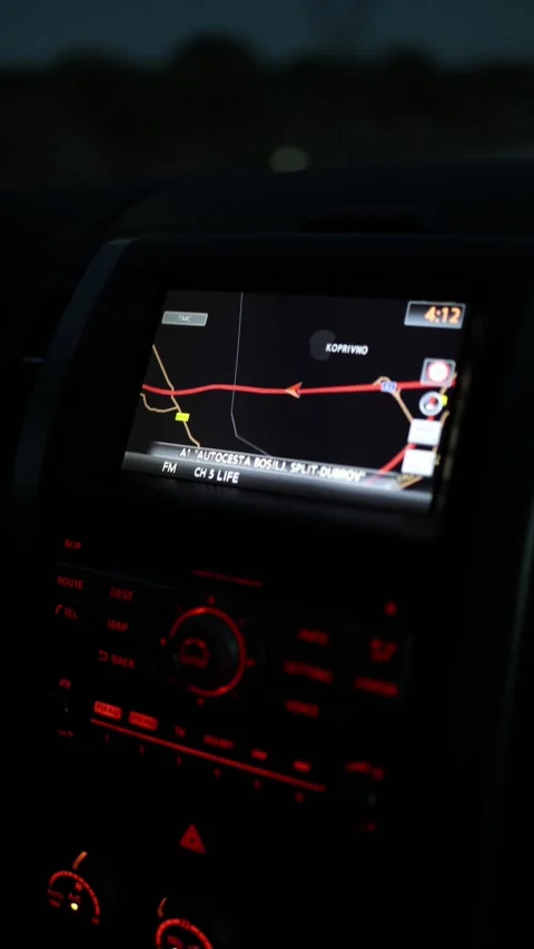Illuminated car navigation screen showing highway route during evening road trip Stock Footage 341621931