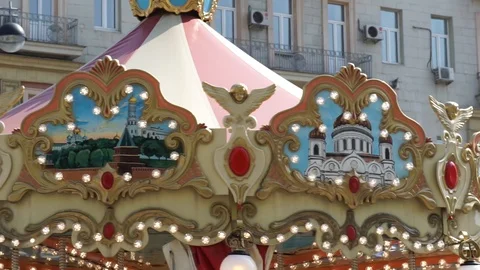 Illuminated carousel daytime Stock Footage 112627605