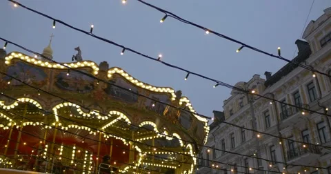 Illuminated Carousel is Rotating Bell Tower Sofia The Kievan Lapm Garlands are Stock Footage 58735463