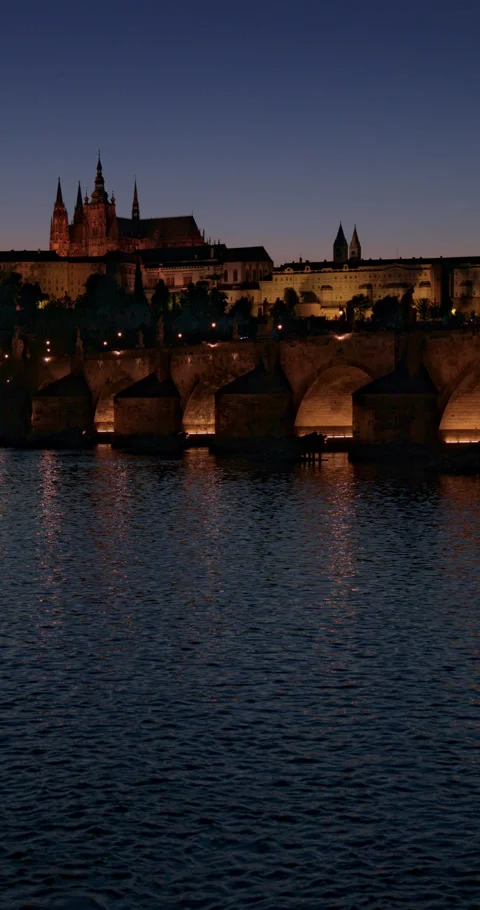 Illuminated Charles Bridge at Evening in Prague with St Vitus Cathedral Stock Footage 342731574
