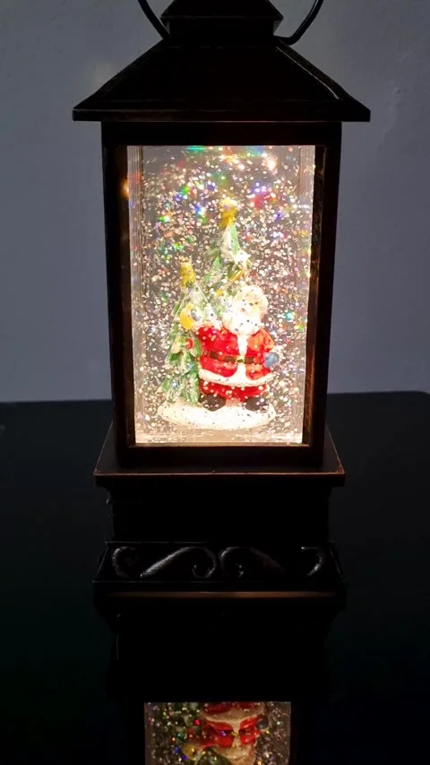 Illuminated Christmas Lantern Decoration Featuring Santa Claus and Christmas Tre Stock Footage 326990703