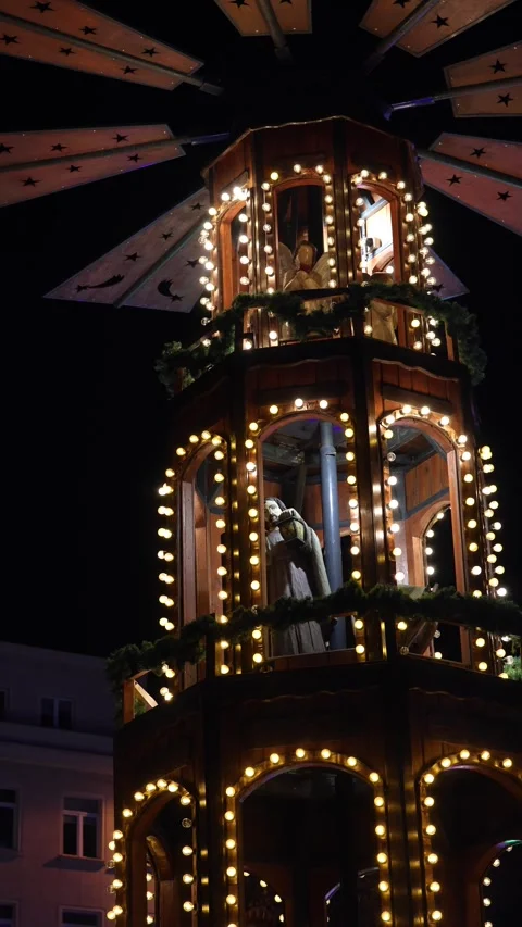 Illuminated Christmas pyramid at a holiday market Stock Footage 293373553
