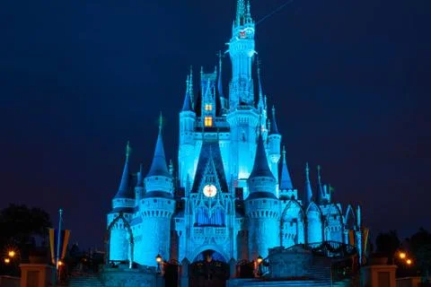 Illuminated Cinderella Castle on blue night background at Magic Kingdom Stock Photos