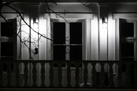 Illuminated classical balcony at night Stock Photos