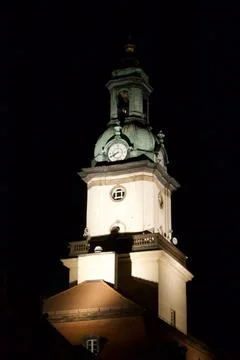 Illuminated clock tower at night Stock Photos