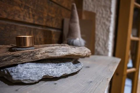 Illuminated container on stack of rustic wood in hotel Stock Photos