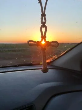Illuminated cross at sunset Fotos de archivo