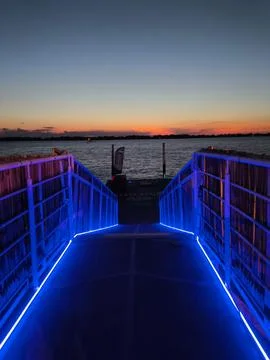 Illuminated dock at sunset Stock Photos