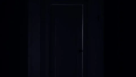 Illuminated Door Frame in Complete Darkness, Wide Shot 動画素材 297877472