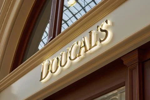 Illuminated Doucal's Boutique Sign Inside Historic GUM Shopping Arcade Stock Photos