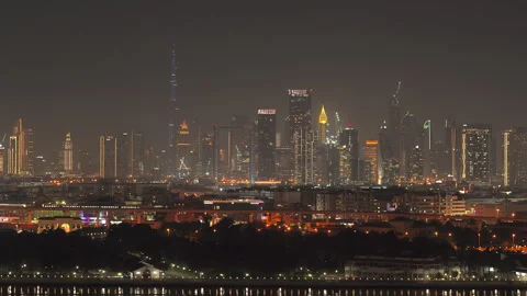 Illuminated Dubai skyline featuring iconic skyscrapers like Burj Khalifa Stock Footage 306552006