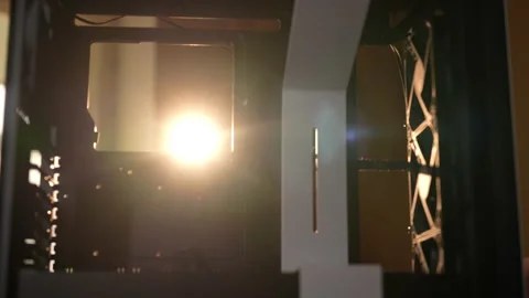 Illuminated dusting inside computer case to prepare for build or upgrade Stock Footage 287515139