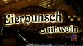 Illuminated Eierpunsch and hot mulled wine sign at Christmas market 4k or 4k+ Resolution