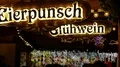 Illuminated Eierpunsch and hot mulled wine sign at Christmas market 4k or 4k+ Resolution