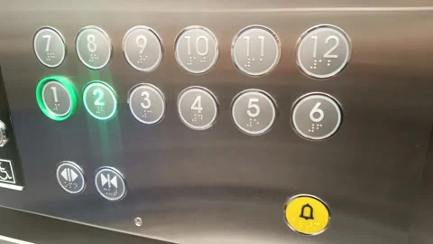Illuminated elevator panel displaying floor selection buttons with braille,.. Stock Footage 303831262