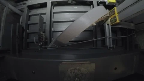 In an illuminated elevator shaft, the cabin moves up. Видео 88415722