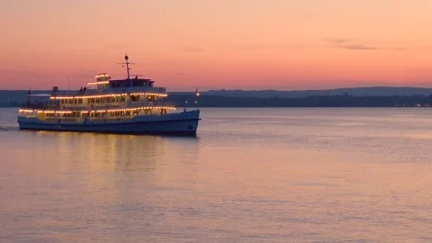 Illuminated excursion boat on Lake Constance in the evening Stock Footage 319997894