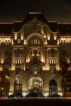 Illuminated facade of Gresham Palace at night in Budapest Stock Photos