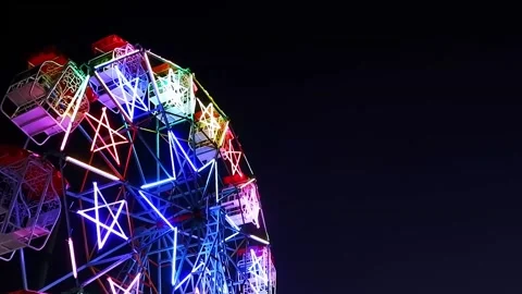 Illuminated ferris wheel Stock Footage 253877436