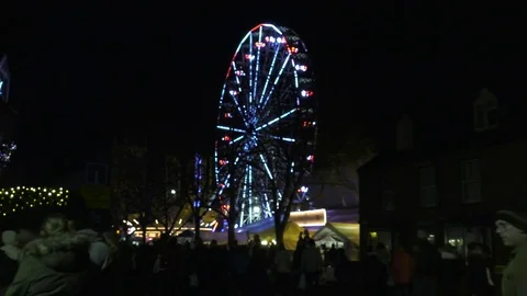 Illuminated Ferris Wheel at Night (Pull Focus) Stock Footage 76100786